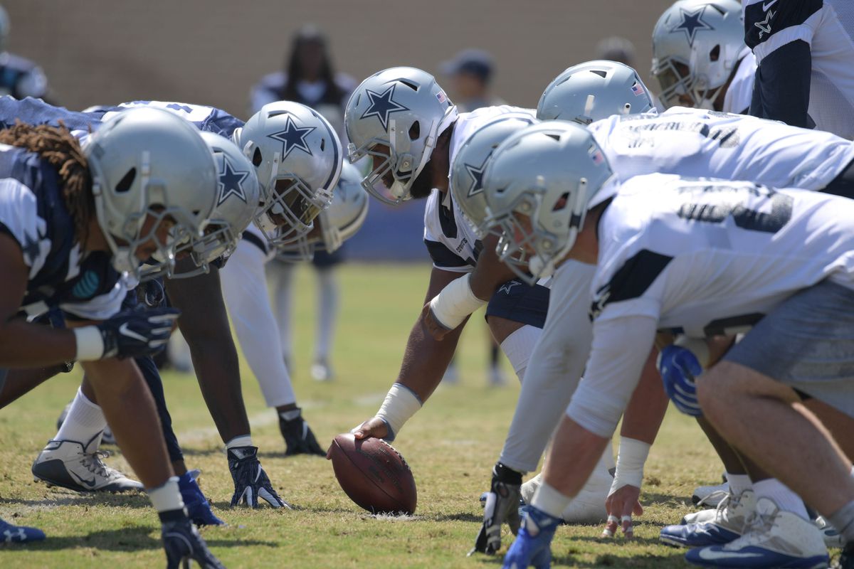 Center Travis Fredrick  gets ready to snap the ball to quarterback Dak Prescott.